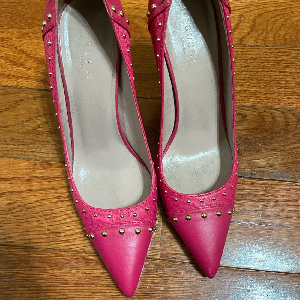 Hot pink Gucci heels with studs